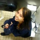 A cute brunette girl poops in a public restroom as her friends peek over the toilet stall to film the action.